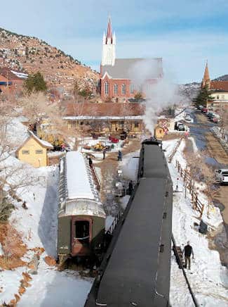 drone shot of depot with trains and saint mary's cathredral in the background
